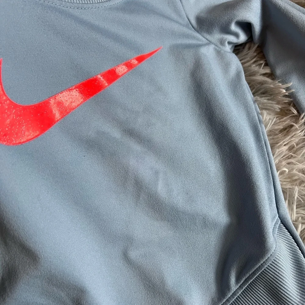 Girls Nike Dri-Fit blue sweatshirt with pink Swoosh